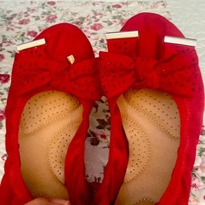 Red flats with silver hardware. Slight ware but has plenty of life left.